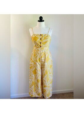 Yellow & White Tropical Leaf Print Sleeveless Jumpsuit With Open Back By FAVLUX
